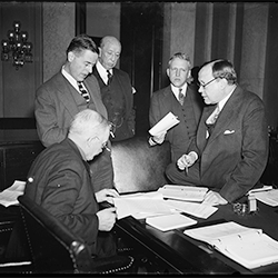 FCA Governor Myers, standing at left, discusses the Farm Credit Bill with the Senate Banking and Currency Committee (Library of Congress, 1935)