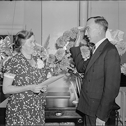 Forrest (“Frosty”) F. Hill, governor, takes oath of office on Sept. 21, 1938. Elsie England, secretary to FCA's general counsel administers oath. He serves until March 26, 1940.  (Library of Congress)