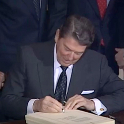 President Ronald Reagan signs the Agricultural Credit Act of 1987 on Jan. 6, 1988.